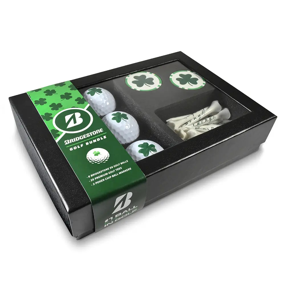 Bridgestone golf bundle with golf balls, tees, and markers featuring a green shamrock print in a gift box.