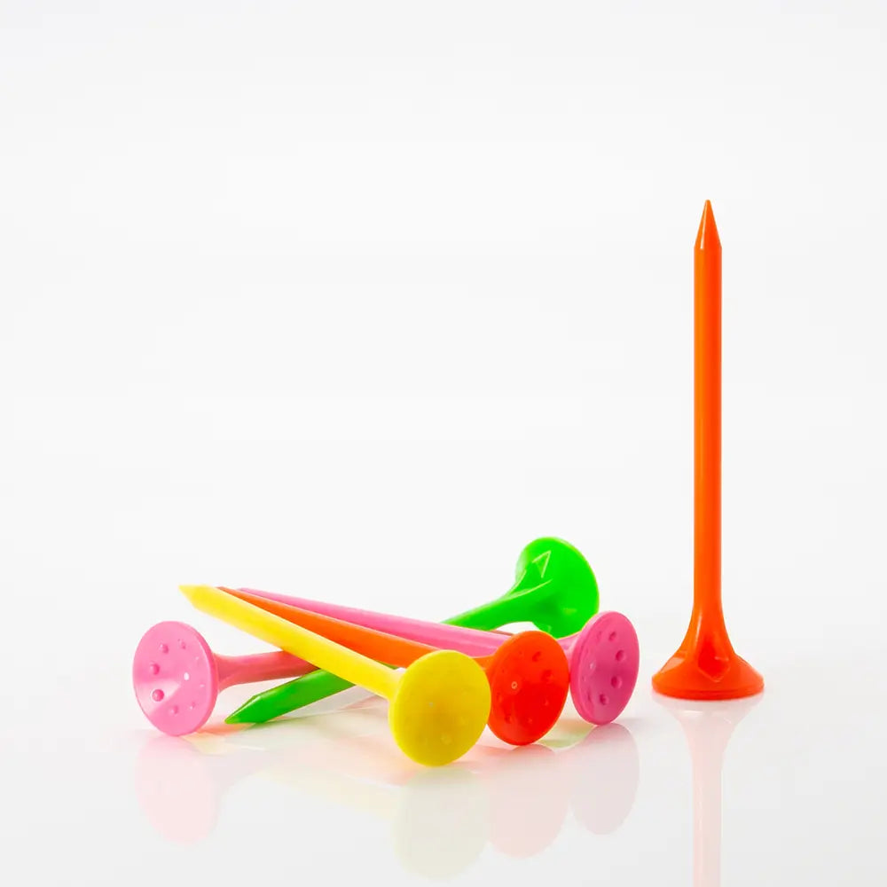 Colorful neon plastic MaxxPro golf tees on a white background