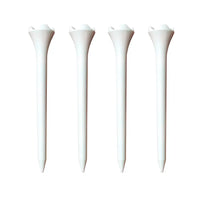 Four white golf tees on a white background