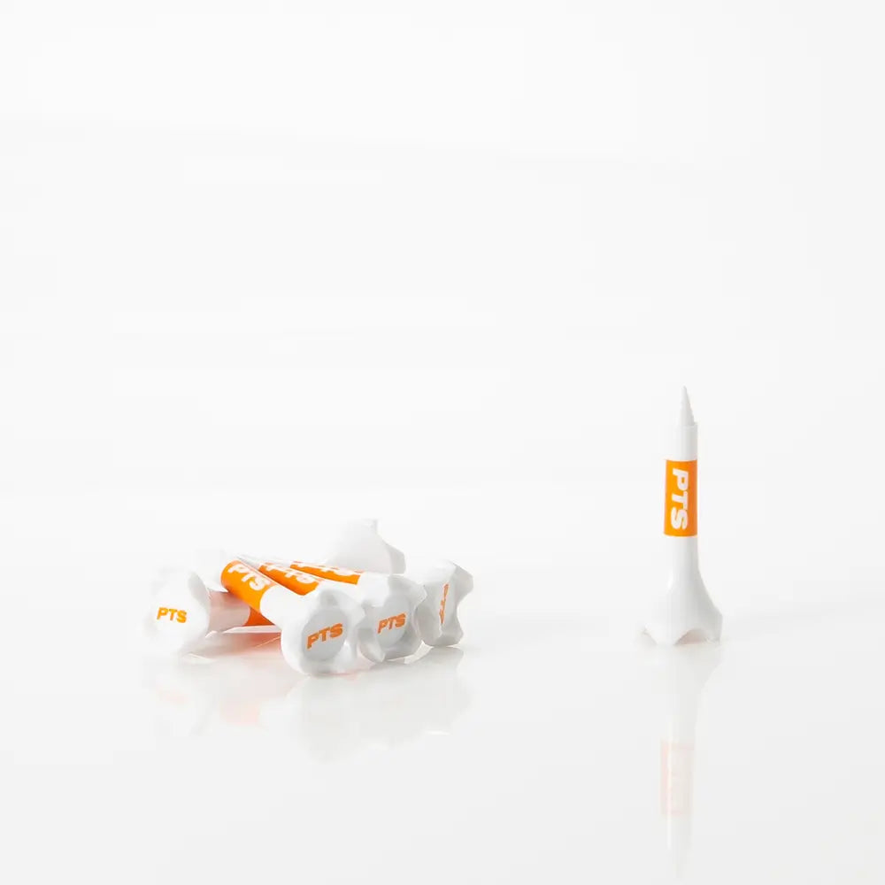 Three PTS golf tees on a white background