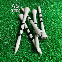 Collection of white golf tees with black stripes and skull and crossbones on a green grass-like background.