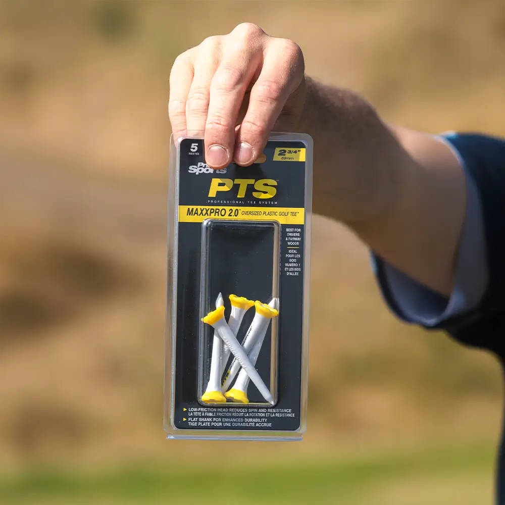 Person holding the PTS® 2-3/4 MaxxPro 2.0 Tees packaging.