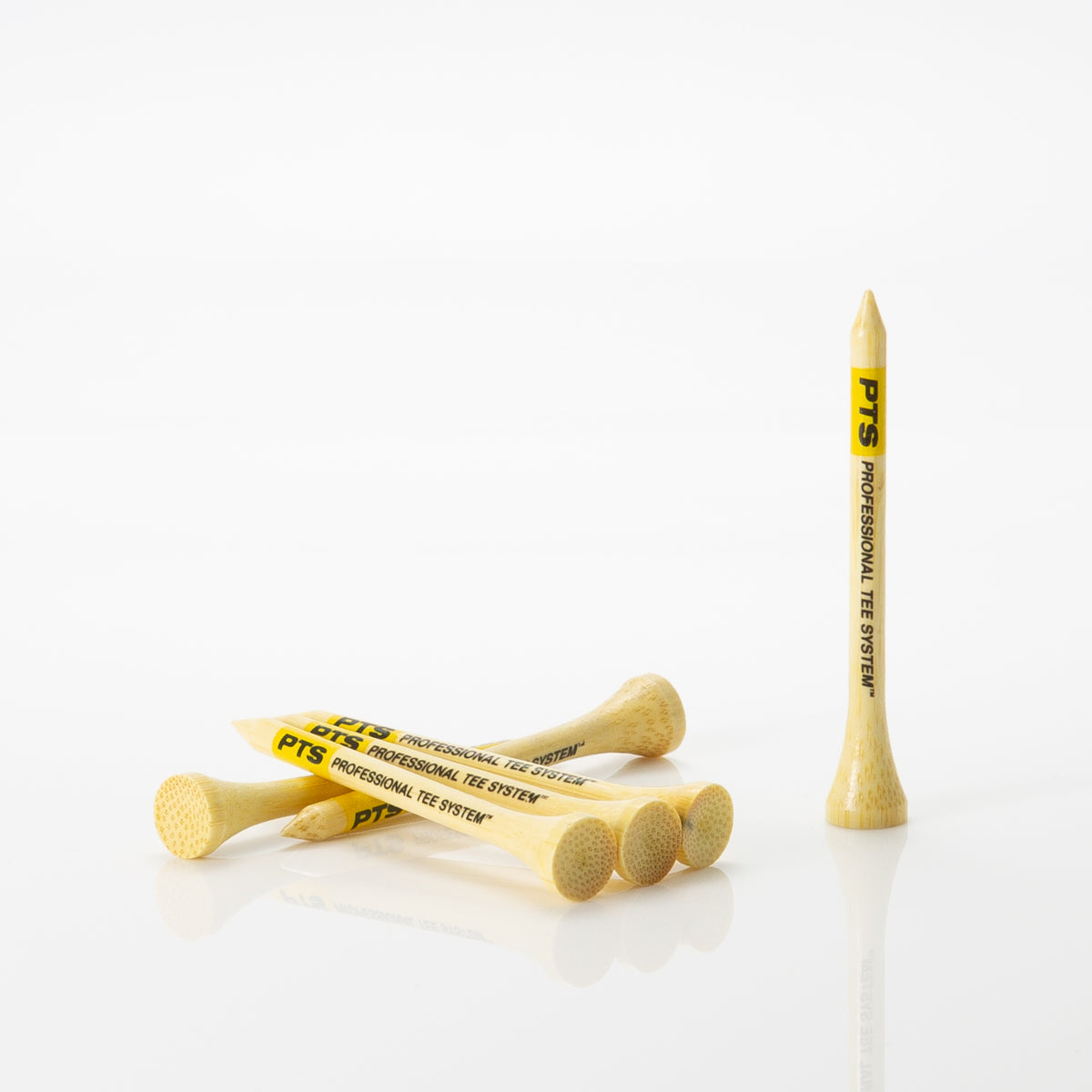 Six Professional Tee System™ (PTS)- 2 3/4" Bamboo Tees laying on one another.