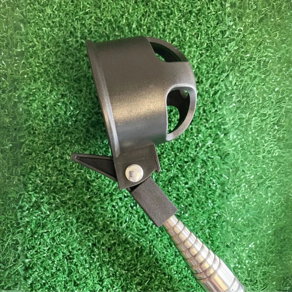 Golf ball retrever on a grass surface