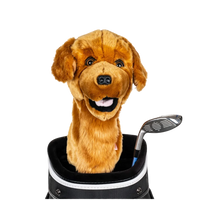 A plush dog golf cover peeks out from a golf bag pocket, beside a golf club.