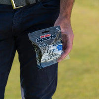 A person holding a package of special edition skull and bones golf tees containing 45 tees that are 3 1/4 inches long.