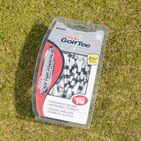 White and black striped Pride Performance tee packaging on green turf. 