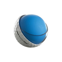 Cut away of a white Titleist golf ball to show blue interior on a white background