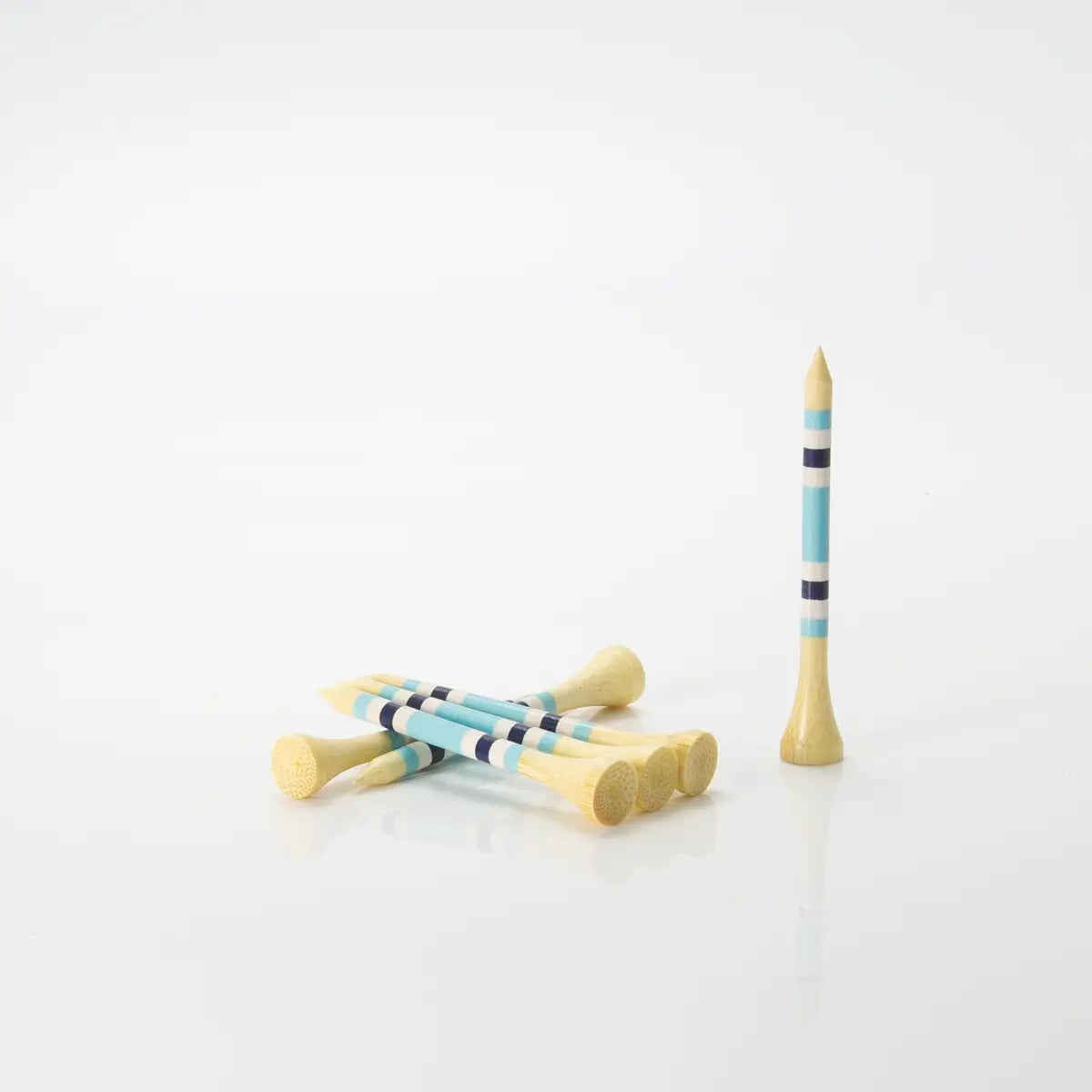 Six Nova Bamboo - Blue/White/Navy tees stacked on one another. 