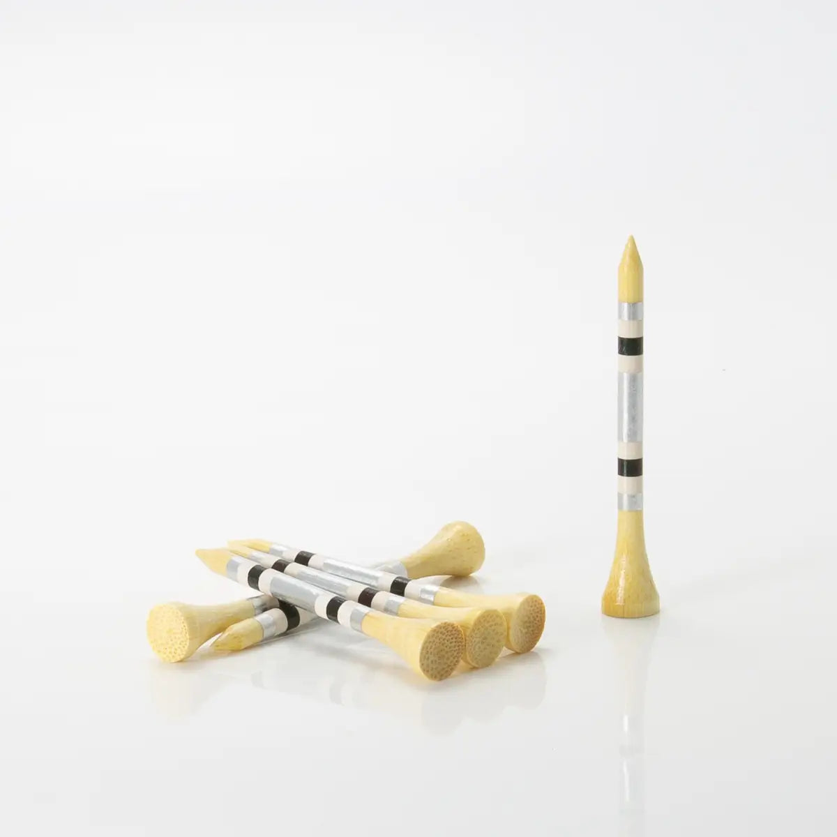 Six 2 ¾" Nova Bamboo - Silver/White/Black tees stacked on one another. 