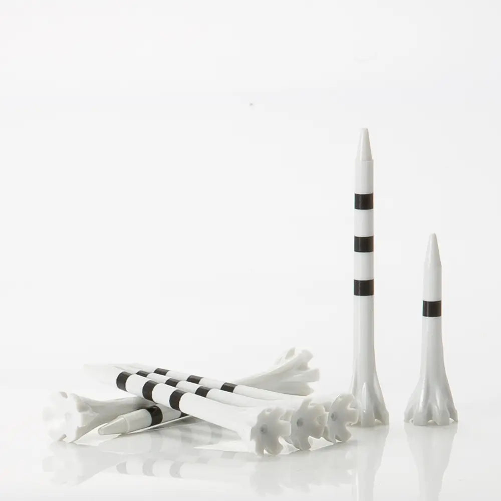 White golf tees with black stripes on a white background