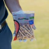 Hand holding a package of Pride Golf Tee with a blurred background