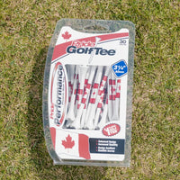Pride Performance canadian golf tees on green turf. 
