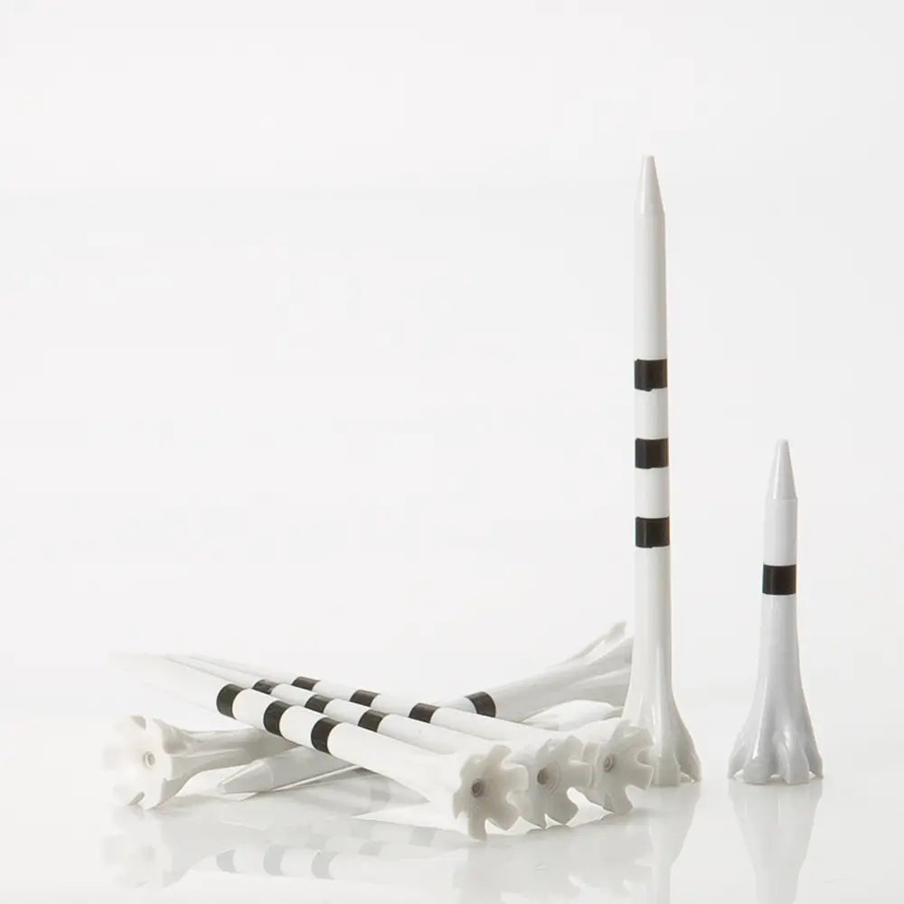 White golf tees with black stripes on a white background