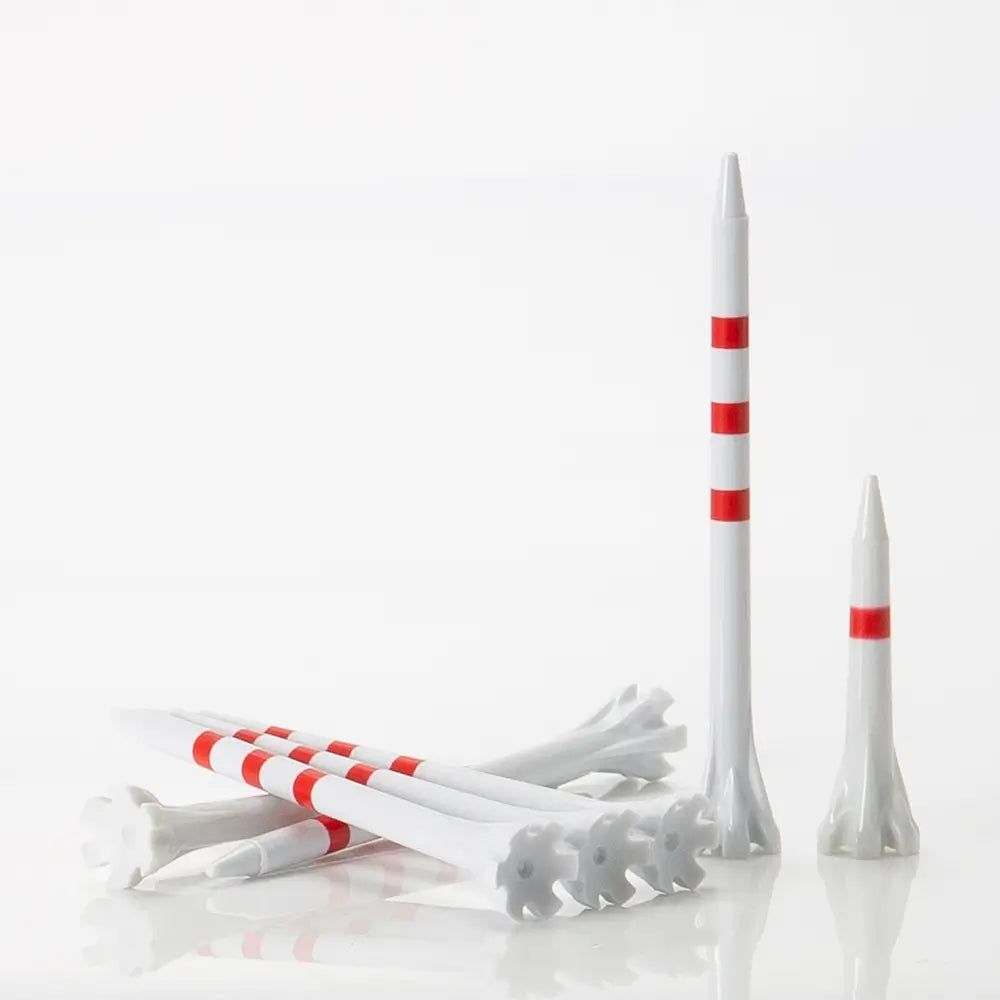White golf tees with red stripes on a white background