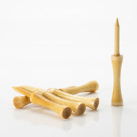 Set of wooden golf tees on a white background