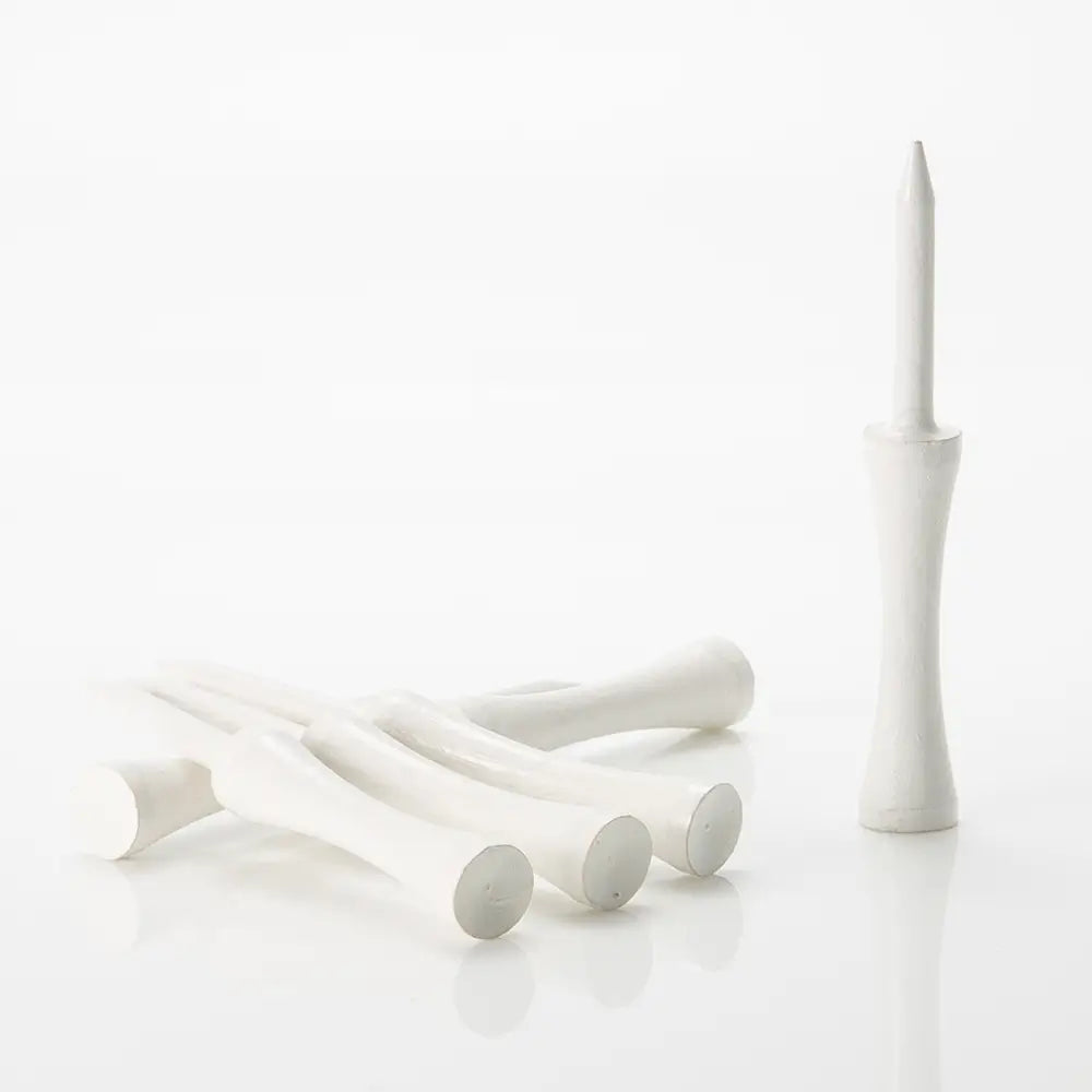Set of wooden white golf tees on a white background
