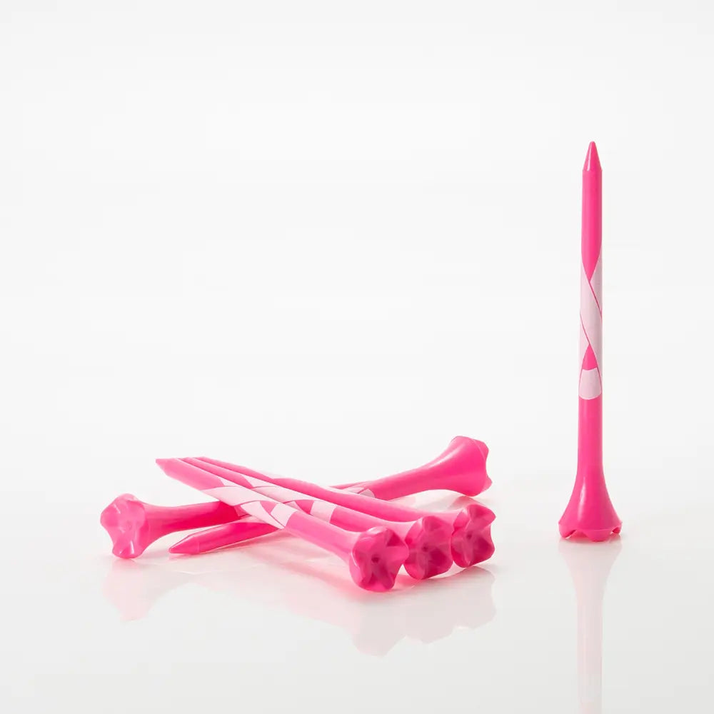 Pink golf tees with a white ribbon on a white background
