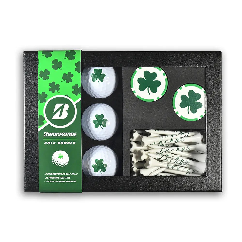 Bridgestone golf bundle with golf balls, tees, and markers featuring a green shamrock print in a gift box.