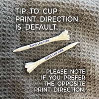 Two 3 1/4" Zarma® FLYtee® Personalized Golf Tees fanned out on a rag. Showing tip to cup print direction is default. 