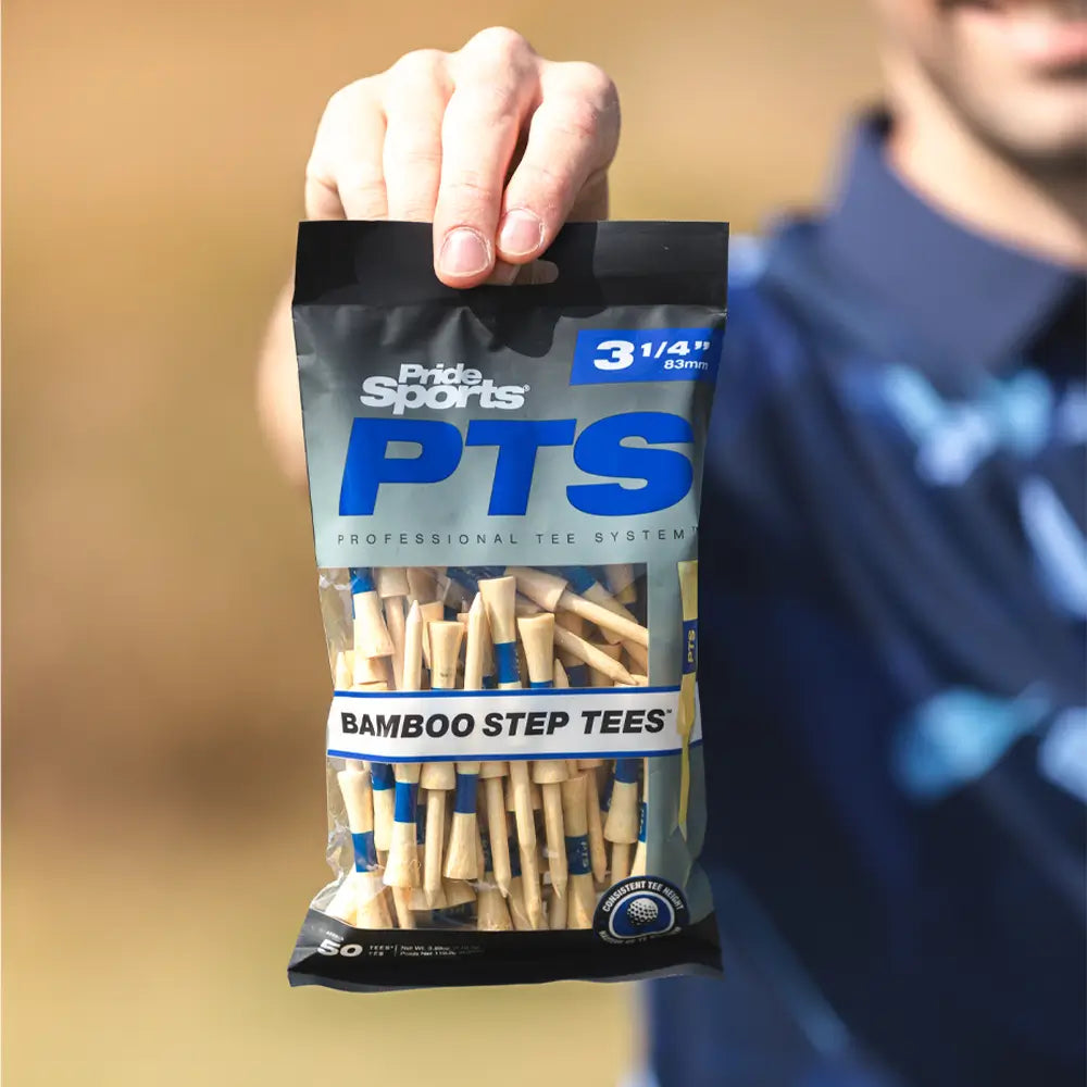 A golfer holding the 3-1/4" PTS bamboo tee packing.