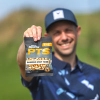 A golfer holding the 1-1/2" PTS bamboo tee packing