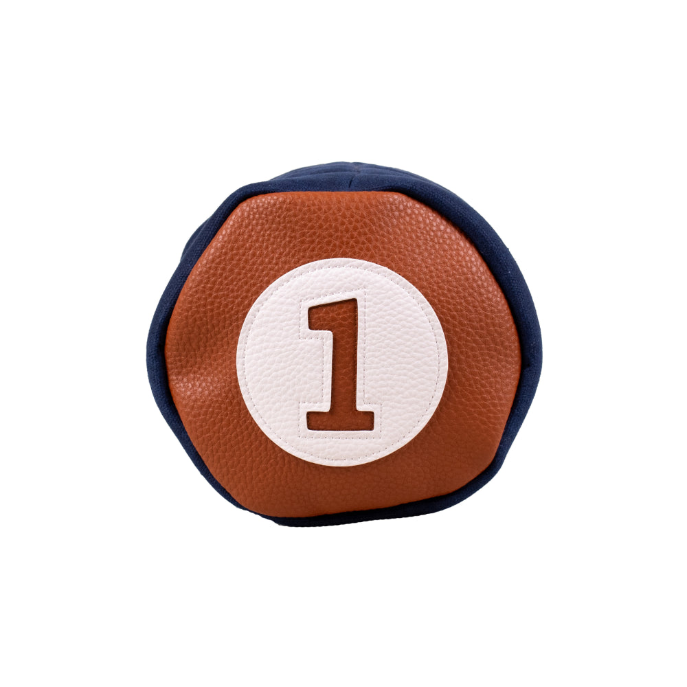 Top view of the Honors Collection barrel driver headcover's brown leather cap with white number 1 patch.