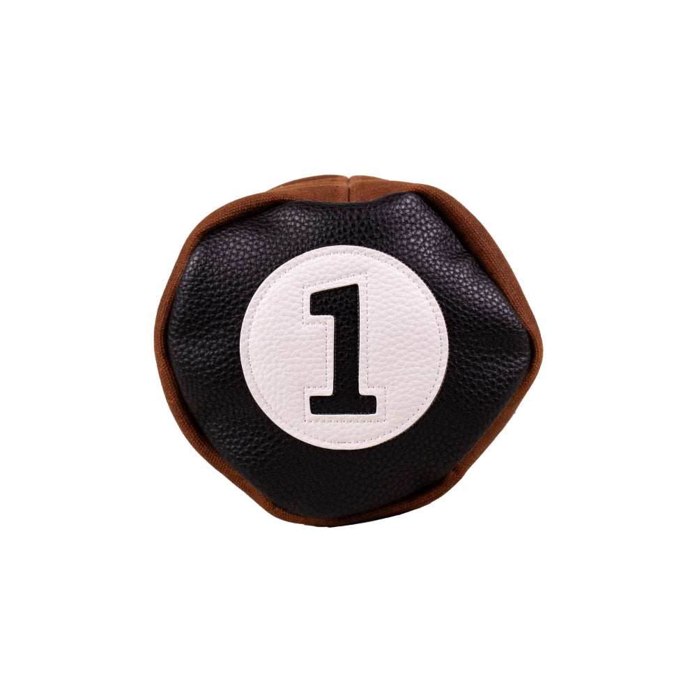 Top view of the Honors Collection barrel driver headcover's black leather cap with white number 1 patch.