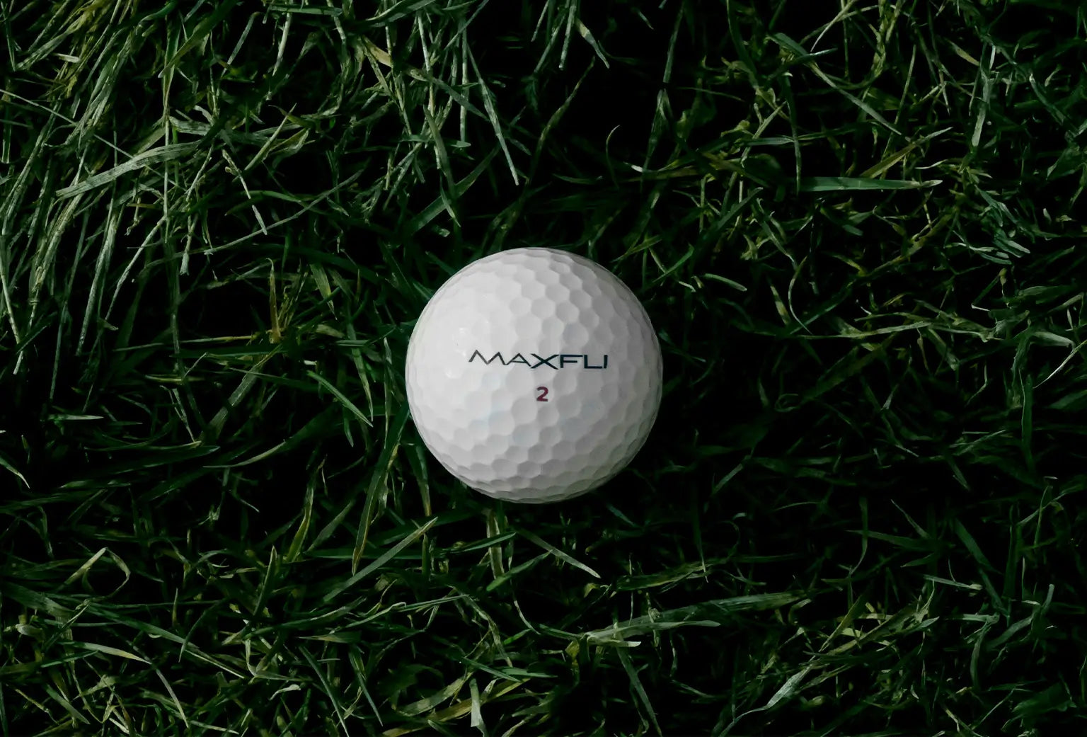 Maxfli golf ball on grass