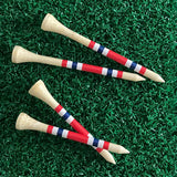 Two sizes of the Nova Bamboo Golf Tees™  on green turf. 