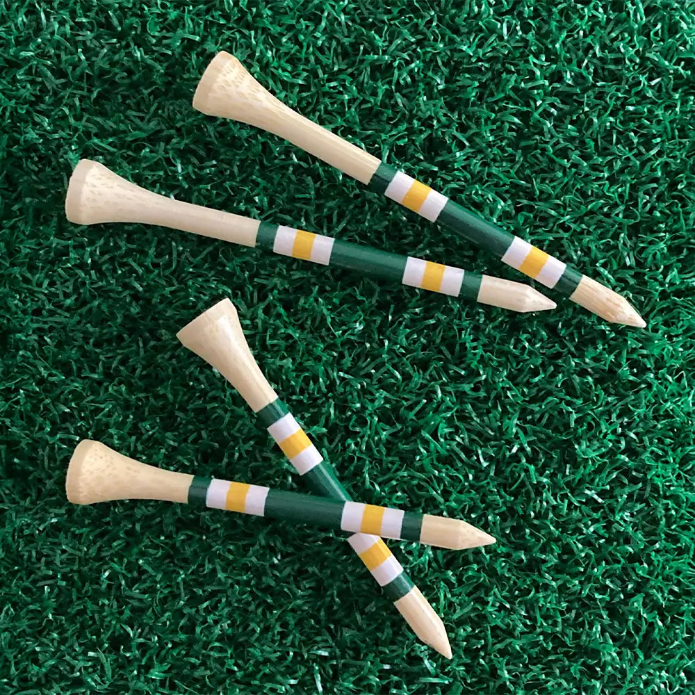 Two sizes of the Nova Bamboo Golf Tees™  on green turf. 