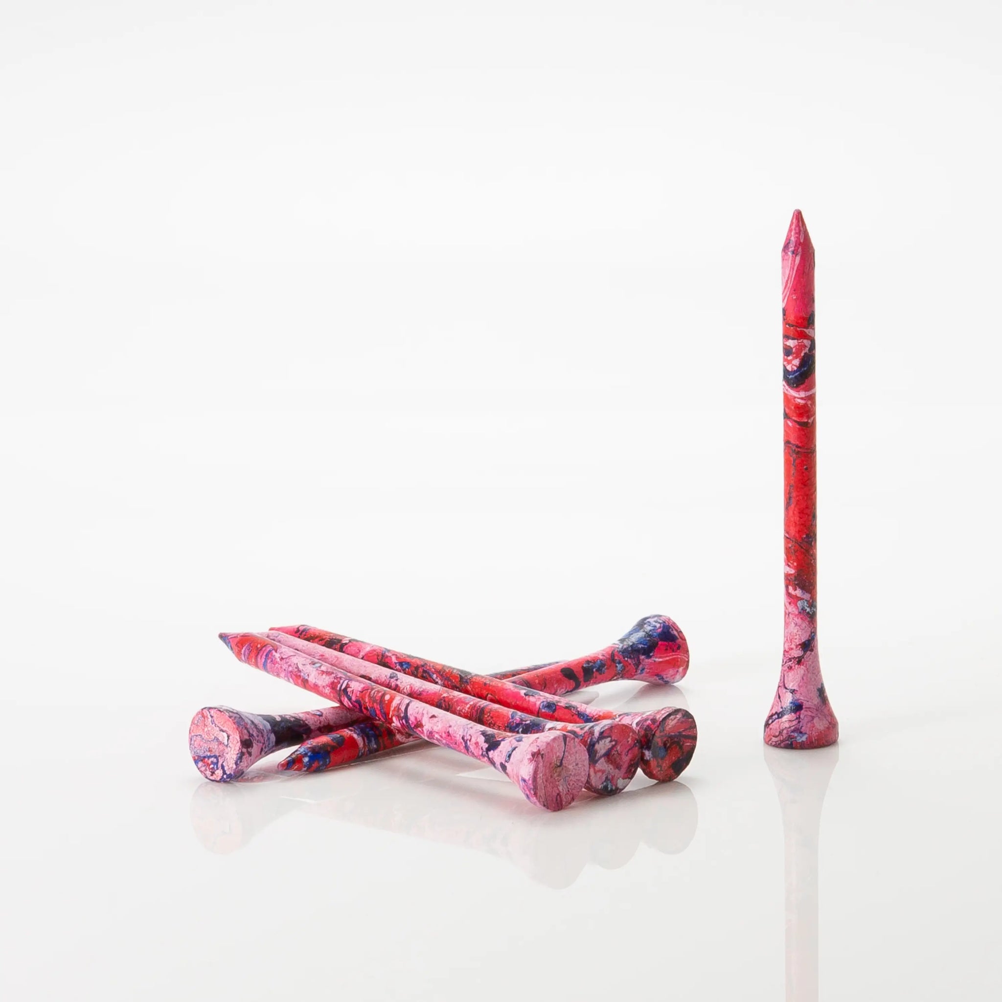 Six red/blue tees laying by one another. 