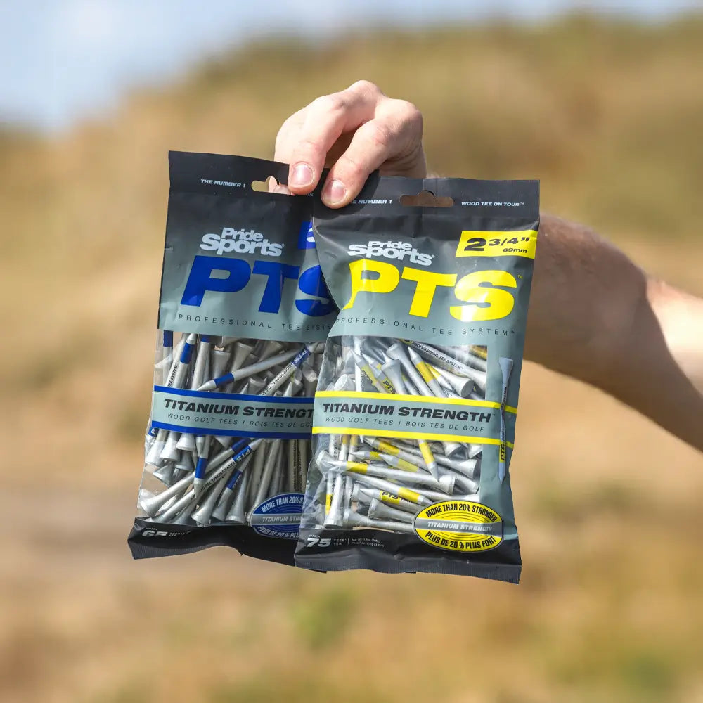 A person holding both bag sizes of the PTS® Titanium Strength™ Wood Golf Tees.