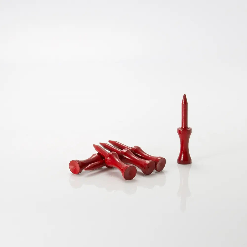 Red golf tees and a tee standing on a white background