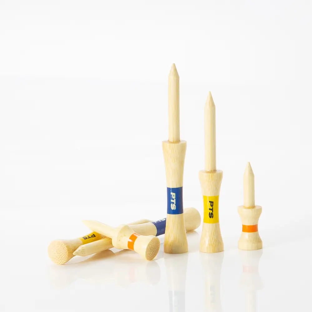 Set of wooden golf tees with colored shafts on a white background