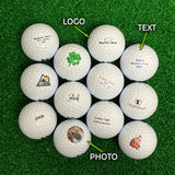 Collection of personalized Bridgestone golf balls with various designs on a green surface