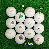 Collection of personalized Bridgestone golf balls with various designs on a green surface