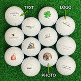 Collection of Titleist golf balls with various text, logo, and photo customizations on a grass background.