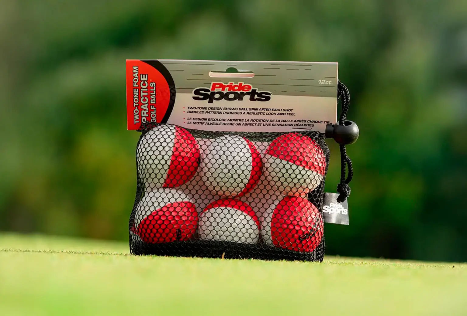 Practice foam ball packaging positioned on a green turf. 