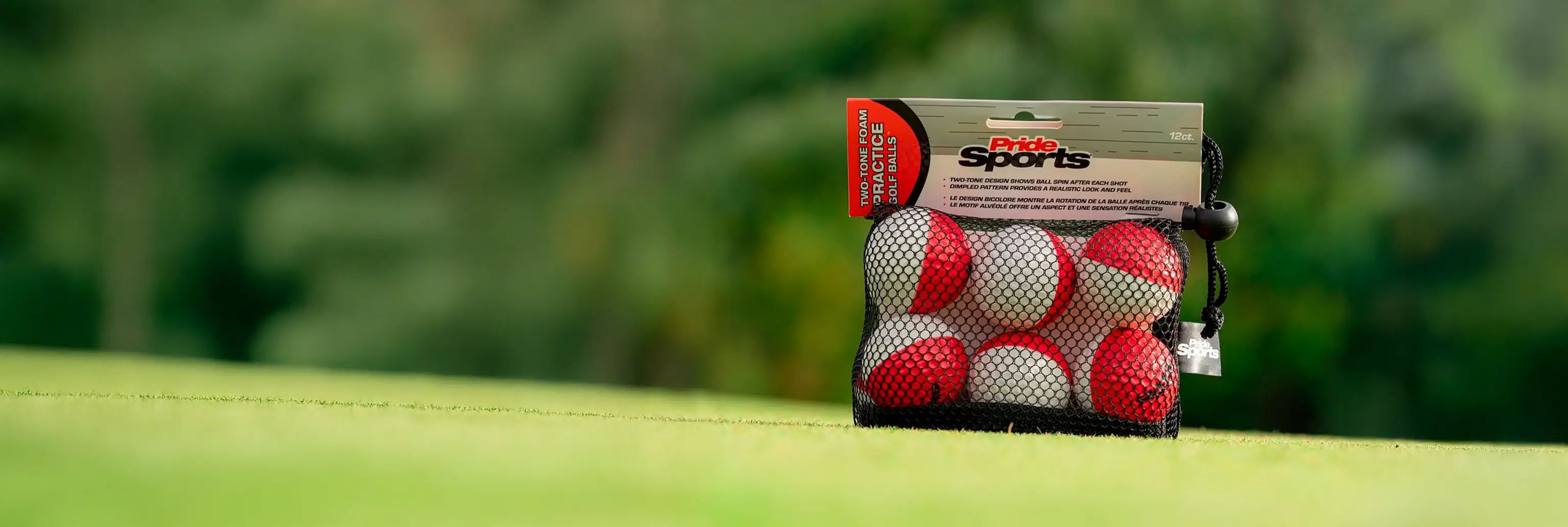 Practice foam ball packaging positioned on a green turf. 