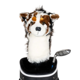 A plush dog headcover peeks out from a golf bag, featuring a fluffy design with brown and white markings.