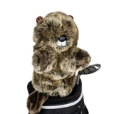A beaver-shaped golf club head cover sitting in a golf bag, with a club peeking out.
