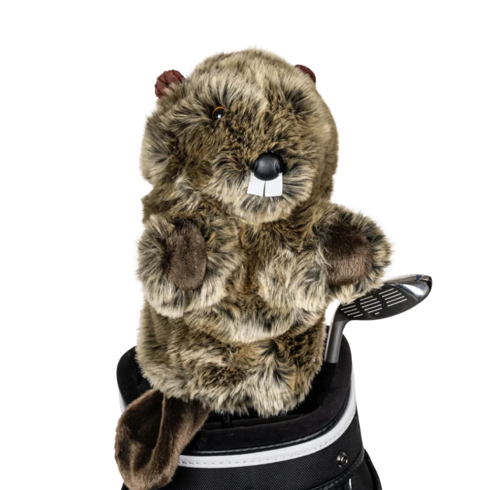 A beaver-shaped golf club head cover sitting in a golf bag, with a club peeking out.