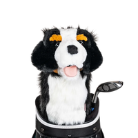 A plush dog headcover peeks out from a golf bag, featuring a fluffy design with black and white markings.