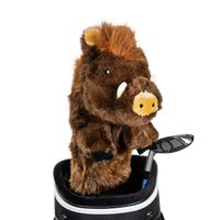 A boar-shaped golf club head cover sitting in a golf bag, with a club peeking out.