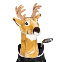 A deer-shaped golf club head cover sitting in a golf bag, with a club peeking out.