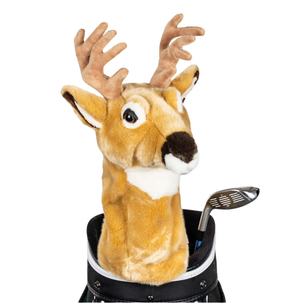 A deer-shaped golf club head cover sitting in a golf bag, with a club peeking out.