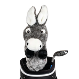 A donkey-shaped golf club head cover sitting in a golf bag, with a club peeking out.