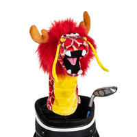 A dragon-shaped golf club head cover sitting in a golf bag, with a club peeking out.