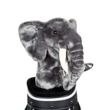 An elephant-shaped golf club head cover sitting in a golf bag, with a club peeking out.